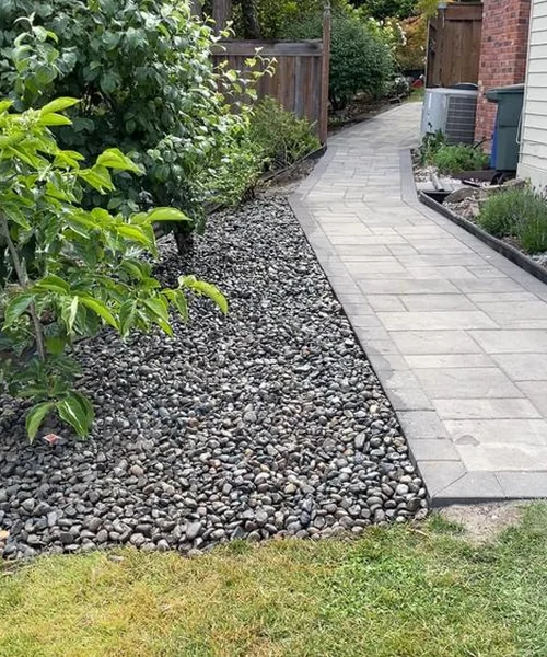 Installation of pavers. Retaining wall. Children's play area and installation of lights in Snohomish 